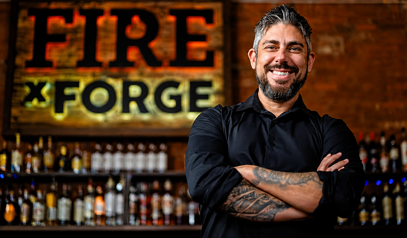 Justin Morales standing in chef whites outside a restaurant